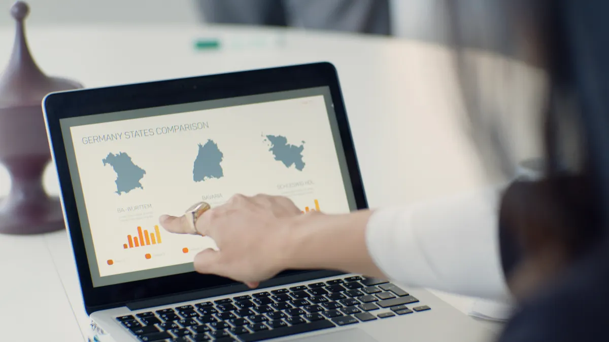 person pointing at a laptop with side-by-side comparison charts